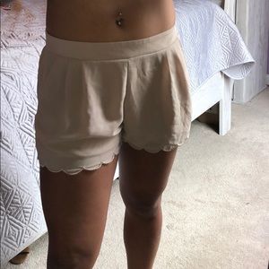 •Tan scalloped shorts•